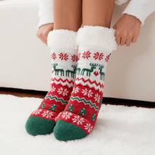 Load image into Gallery viewer, The Foozie™ Christmas Winterland, red, white and green reindeer and snowflake knit, hands pulling up the sherpa cuffs