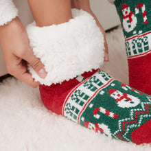 Load image into Gallery viewer, The Foozie™ Christmas Snowman slipper socks, close-up of hands holding the thick sherpa cuff open