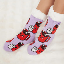 Load image into Gallery viewer, The Foozie™ Marshmallow slipper socks, hot chocolate mug and marshmallow print on lilac, worn on a fluffy white rug