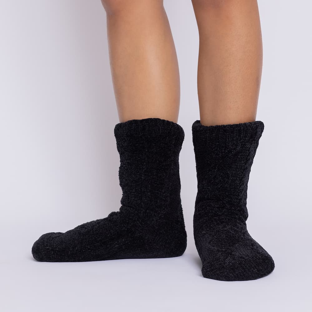 The Foozie™ Move in Black, front view of both feet showing the diamond cable knit