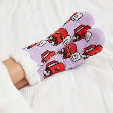 Load image into Gallery viewer, The Foozie™ Marshmallow slipper socks, crossed feet on a white bed with the sherpa cuffs folded down
