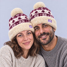 Load image into Gallery viewer, The Foozie™ Nordic Christmas Beanie, worn by a couple
