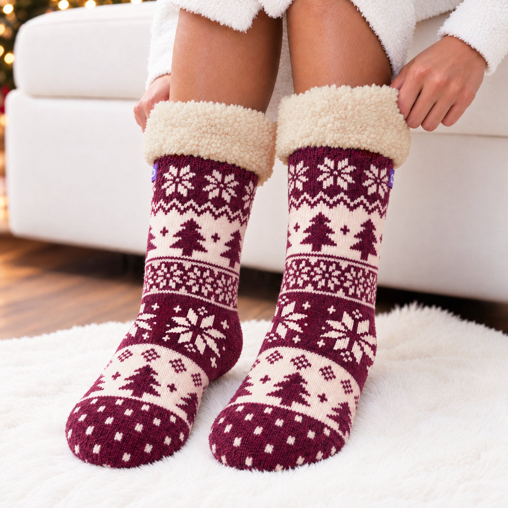 The Foozie™ Christmas Nordic slipper socks, standing on a rug