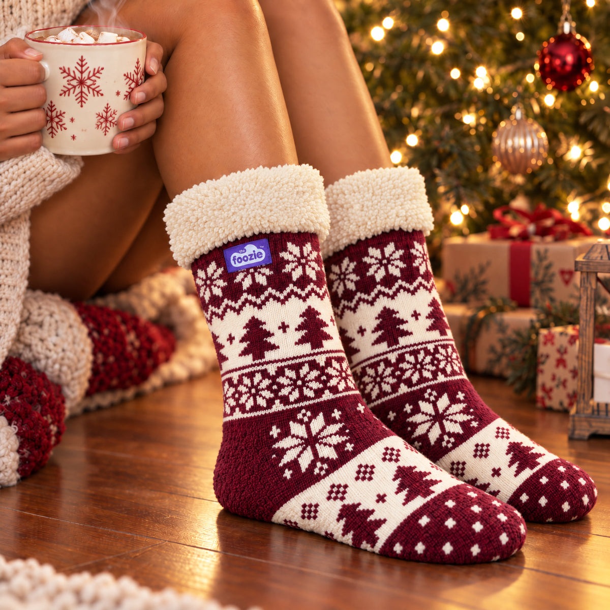 The Foozie™ Christmas Nordic slipper socks, by the Christmas tree