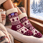The Foozie™ Christmas Nordic slipper socks, on a window seat