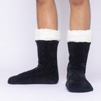 The Foozie™ in Black, front view of both feet worn in Medium with the sherpa cuffs folded down
